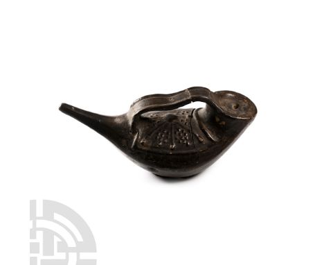 1st-4th century A.D. Horn-shaped body with slender nozzle, triangular-section body and broad discoid end, socketted and with 