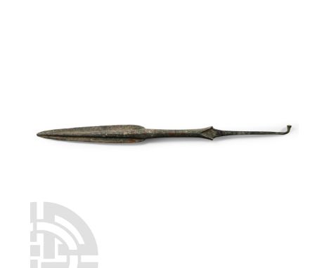 Late 2nd millennium B.C. With ovate blade, central round rib and curved shoulders, the cylindrical long shaft widening toward
