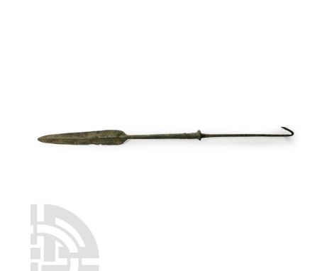 Late 2nd millennium B.C. With ovate blade, central rib and curved shoulders, the round-section long shaft tapering towards th