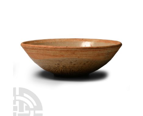 Tang Dynasty, 618-907 A.D. or later. Shallow bowl with peach-coloured rim, circular step to the centre, basal ring.  234 gram