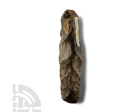 Neolithic Period, circa 6000 B.P. Sturdy square-section shank with irregular butt and broad cutting edge; cortex to handle; o