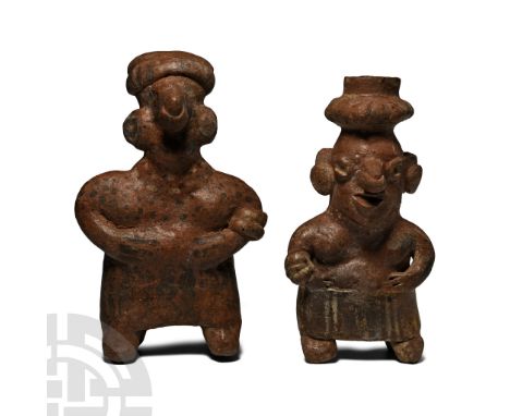 100 B.C.-250 A.D. Each modelled in the round; the female wearing an ankle-length skirt, bracelet on her right arm, disc ear-l