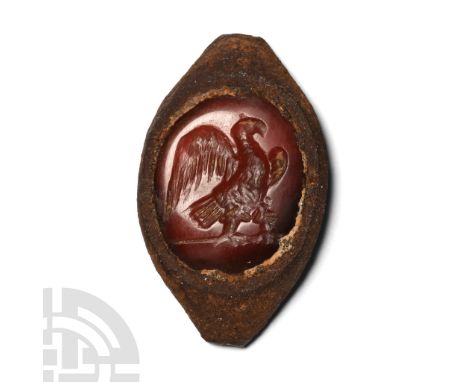 1st-2nd century A.D. Ellipsoid intaglio with large bird perched on a baseline, wings spread as if about to take flight; mount