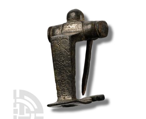 2nd century A.D. Comprising a chord housed with a horizontal sleeve with median lug above and pin to the rear; right-angled b