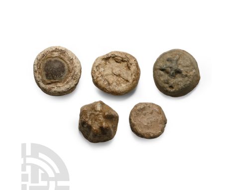 9th-11th century A.D. Including discoid, crenelated and other types.  70 grams total, 15-20 mm (1/2 - 3/4 in.). [5, No Reserv