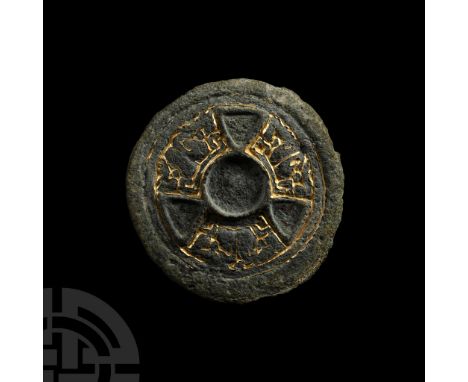 530-570 A.D. Single-piece disc brooch with broad rim, inner band and segmented tondo with three triangular cells to accept in