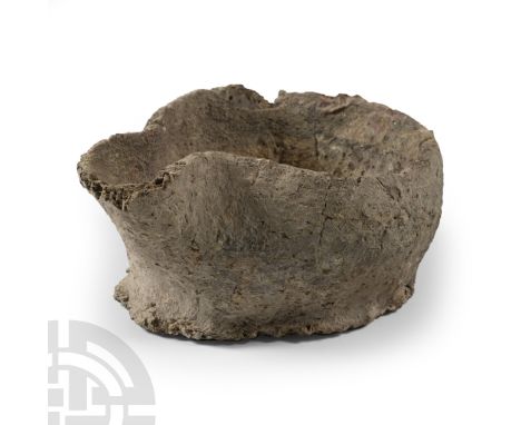 Circa 10th century B.C. With flat base and thick sidewall tapering to the rim, C-shaped pouring lip; inked legends to undersi