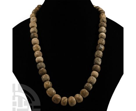 Pleistocene Period, 2.6 million-11,700 years B.P. Restrung using recently polished Mammuthus primigenius bone beads. See Guid