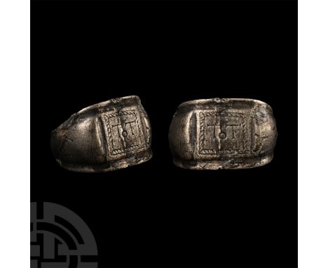 1st-2nd century A.D. With a wide, grooved hoop expanding at the shoulders, rectangular plaque with ropework border enclosing 