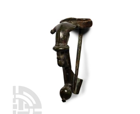 1st-2nd century A.D. With chord developing to a sturdy pin, carinated bow with lateral knops, collar to the equator with duck