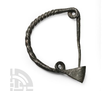 Early Iron Age, 8th century B.C. Single-piece fibula comprising a thick twisted bow with integral coiled spring to one end de