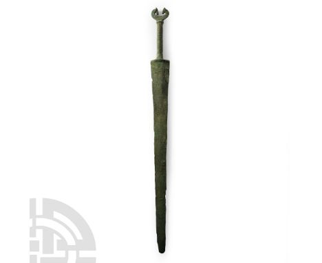 8th century B.C. Pointed blade with shallow midrib increasing in width near the ricasso, cast in one with the hilt, square sh