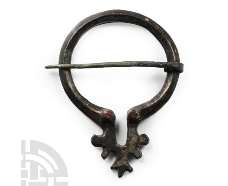 14th century A.D. Omega-shaped triangular-section roundel with applied metallic finish. See Sedov, B.B., Finno-Ugri i Balti v