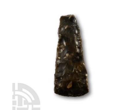 Neolithic Period, circa 1500 B.P. Narrow thick-butted with flared sides, rectangular in section with gently curved edge. Cf. 
