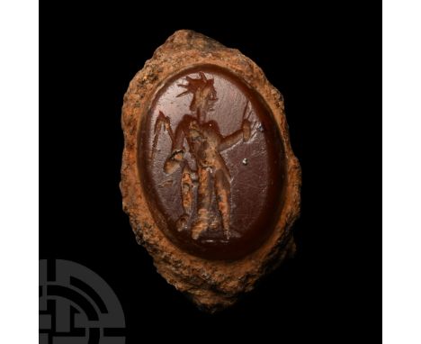 2nd-3rd century A.D. Ellipsoid cloison with intaglio figure of Sol standing with sceptre in one hand, the other extended, rad