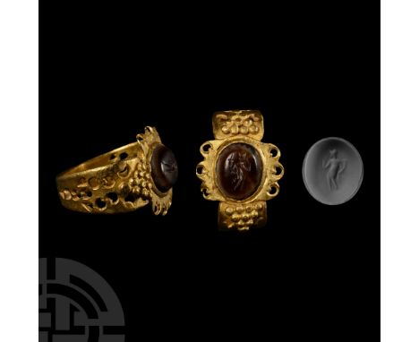 3rd-4th century A.D. An amber coloured intaglio of the young goddess Fortuna holding a cornucopia in her left hand, right han