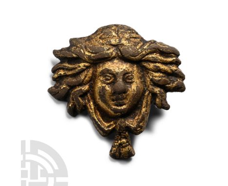 16th-17th century A.D. Modelled as the face of a woman with flowing hair, a sash wrapped around the head and the ends tied be