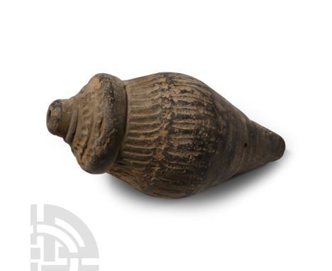13th-15th century A.D. A hollow vessel with cylindrical body, short neck and domed mouth, impressed linear decoration to the 