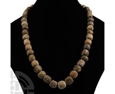 Pleistocene Period, 2.6 million-11,700 years B.P. Restrung using recently polished Mammuthus primigenius bone beads. See Guid