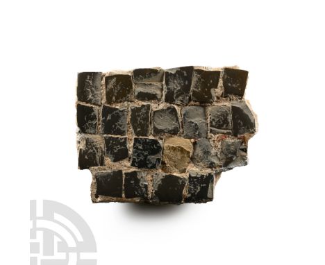 2nd-4th century A.D. With oblong tesserae in matrix, mainly blue-grey in colour on the exposed faces but pale grey to the und