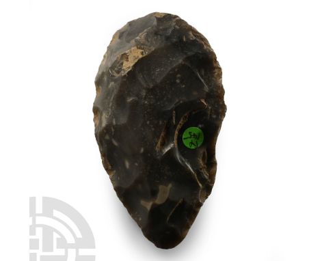 Neolithic Period, 6th-4th millennium B.P. Ovate in profile with carefully worked edge; old collector's label '14 145'.  131 g