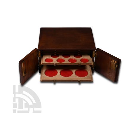 Vintage Eight Tray Coin Cabinet with Key. 20th century A.D. In dark wood, the coin trays with circular openings and red felt 