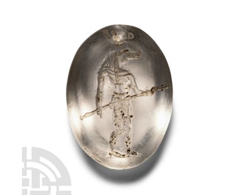 1st century A.D. Lentoid in section with engraved image of the crocodile-headed god Sobek, wearing a broad collar and pleated