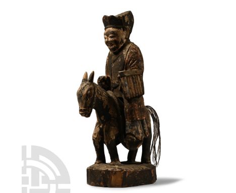 Ming Dynasty, 1368-1644 A.D. Carved in the depicting a robed traveller on a donkey; the figure wearing an ankle-length robe a