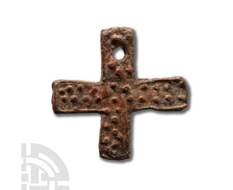 Circa 4th century A.D. Flat-section pendant cross with pointillé detailing to the obverse.  7.4 grams, 34 mm (1 3/8 in.). [No
