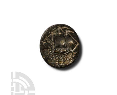 18th century A.D. Bifacial disc with attachment points for the swivel; obverse: profile bust of a male with beard and plumed 