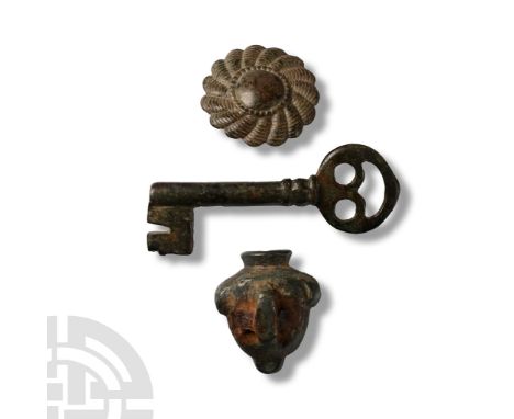 17th-19th century A.D. Comprising: barrel-type key, domed button with loop, lock cover with studs to reverse.  43.6 grams tot