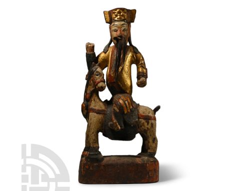 17th-18th century A.D. Carved in the round mounted on a horse on a rectangular base; the figure with gilded kaftan riding coa