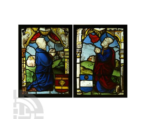 Bern, Switzerland, circa 1520 A.D. Pair of stained glass window panels comprising: a kneeling female figure in a blue robe in