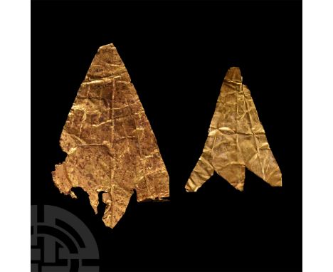 2nd-1st century B.C. Comprising two sheet-gold leaf elements from a diadem, teach with dentilled end and impressed divergent 