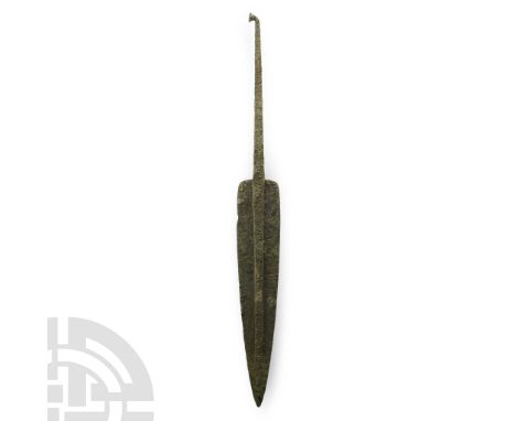 14th-10th century B.C. Elongated tapering triangular blade, with broad midrib and squared shoulders slightly rounded at the c