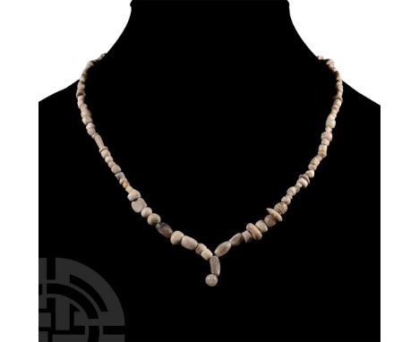 1st millennium B.C. and later. Restrung group of graduated tubular, annular, fusiform and other beads in stone, shell, and ce