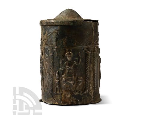 1st-2nd century A.D. Tubular in construction with domed lid, sidewall with repoussé arcade frieze depicting Mercury with cadu