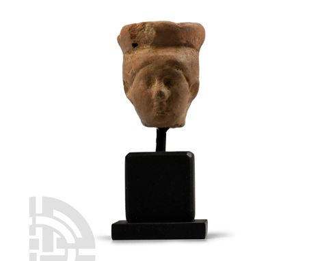 1st-4th century A.D. Modelled in the round with circular headdress above the hair drawn back to the nape of the neck; mounted