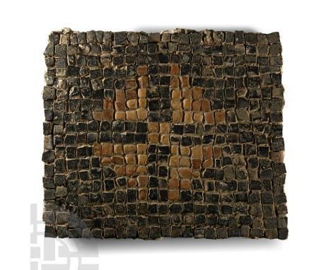 2nd-4th century A.D. Cuboid tesserae in matrix with a plaster base; field in dark grey and brown with central lozenge in crea