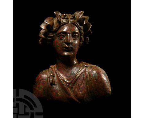3rd-2nd century B.C. Modelled in the half-round as a maenad or Artemis, hollow to the reverse with diadem of ivy leaves with 