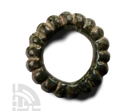 La Tène B, 3rd century B.C. D-shaped in section, segmented on the outer face into a series of convex knobs, each separated by