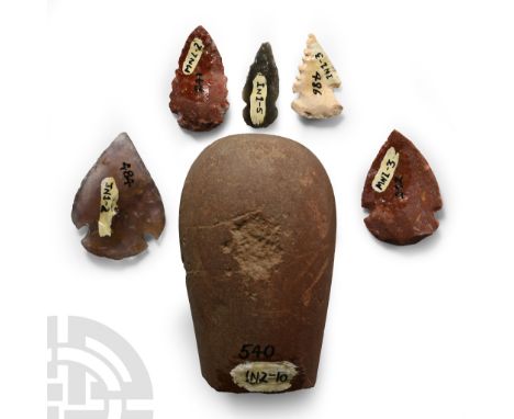 Desert Culture, circa 1700 A.D. Comprising mainly small flaked, barbed arrowheads and a large hammerstone.  195 grams total, 