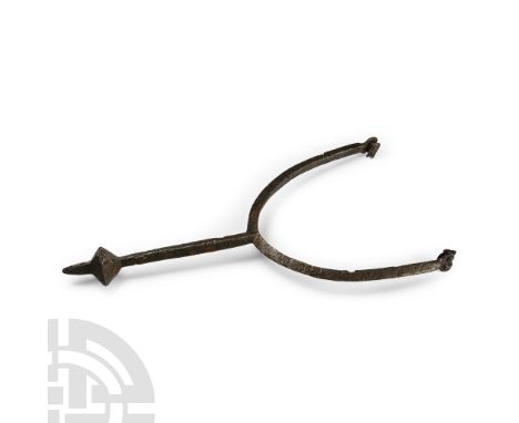 11th-12th century A.D. With rectangular finials, D-section frame, lozenge-section shank, facetted bulb and conical prick. Cf.