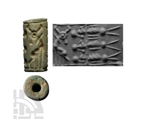 1500-1200 B.C. Cylinder with cord and bead handles; accompanied by a copy of an old scholarly note, typed and signed by W.G. 
