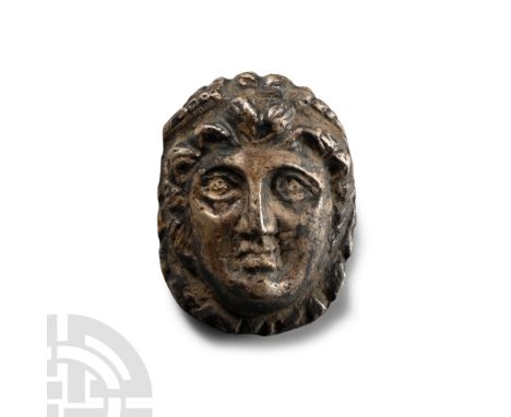 2nd-4th century A.D. Applique with repousse detailing, mask of Alexander the Great or Dionysus with diadem to his brow. Cf. R