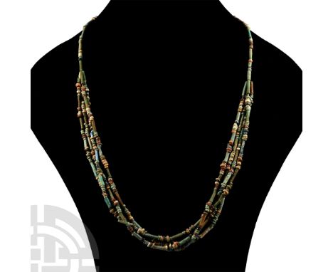 Late Period, 664-332 B.C. Multi-stranded designer necklace composed of beads of mainly annular and cylindrical types; restrun