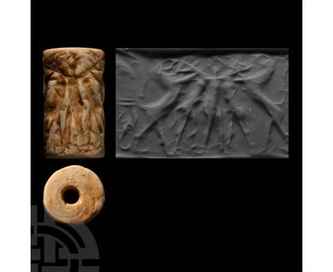 2600-2300 B.C. Cylinder with cord and bead handles; accompanied by a copy of an old scholarly note, typed and signed by W.G. 
