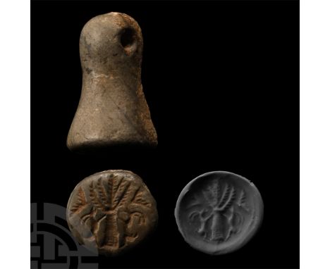 1st millennium B.C. Conical in profile with pierced lug handle; intaglio figure of the 'Tree of Life' with lateral rampant ib