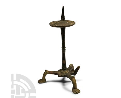 4th-6th century A.D. Tripod base formed with lion-paw feet and rosette of interstitial panels, balustered stem and dished pan