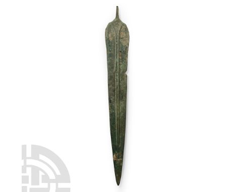 2nd-1st millennium B.C. A two-edged leaf-shaped blade with short rectangular tang, corrugated midrib extending almost to the 
